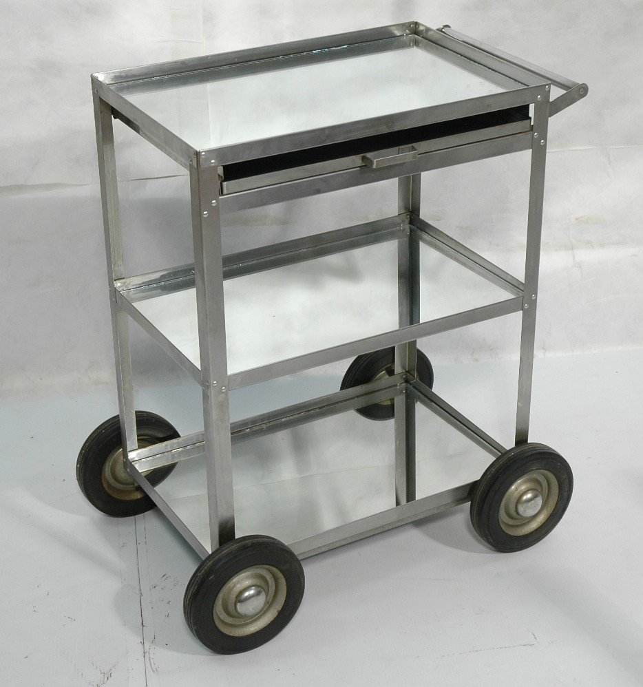 Industrial 2 Tier Rolling Cart. Shelves lined wit: Industrial 2 Tier Rolling Cart. Shelves lined with mirror. Large rubber wheels. Marked: Cal-Det Products.-- Dimensions: H: 33 inches: W: 26 inches: D: 15 inches ---