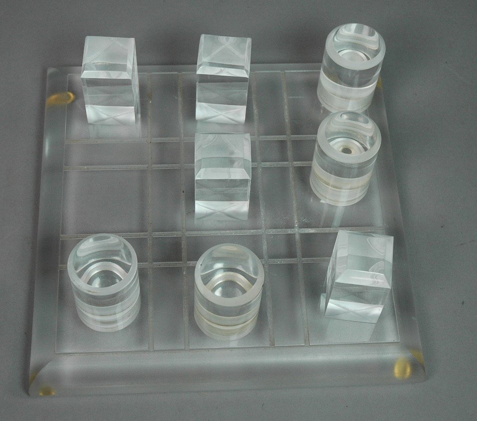 Modernist Lucite Tic Tac Toe Game. Lucite Board w: Modernist Lucite Tic Tac Toe Game. Lucite Board with tall Lucite X & 0. -- Dimensions: H: 4 inches: W: 10.75 inches: D: 10.75 inches --- US Shipping charge: $28