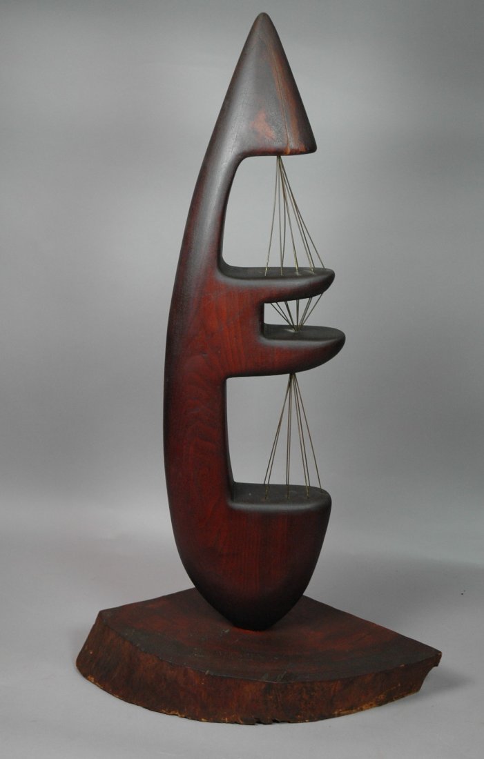 BARBARA HEPWORTH style American Studio Walnut Mod: BARBARA HEPWORTH style American Studio Walnut Modernist Sculpture. Teardrop form with wire details. Thick 3" wood slab base. Unmarked. -- Dimensions: H: 36 inches: W: 19 inches: D: 11 inches ---