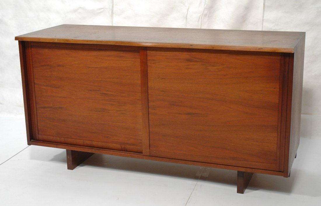 GEORGE NAKASHIMA Two Door Credenza Cabinet. Walnu: GEORGE NAKASHIMA Two Door Credenza Cabinet. Walnut freeform slab top. American Woodworker. Dovetail detail. Solid walnut feet. Interior fitted with 2 shelves & 4 drawers. -- Dimensions: H: 32 inches: