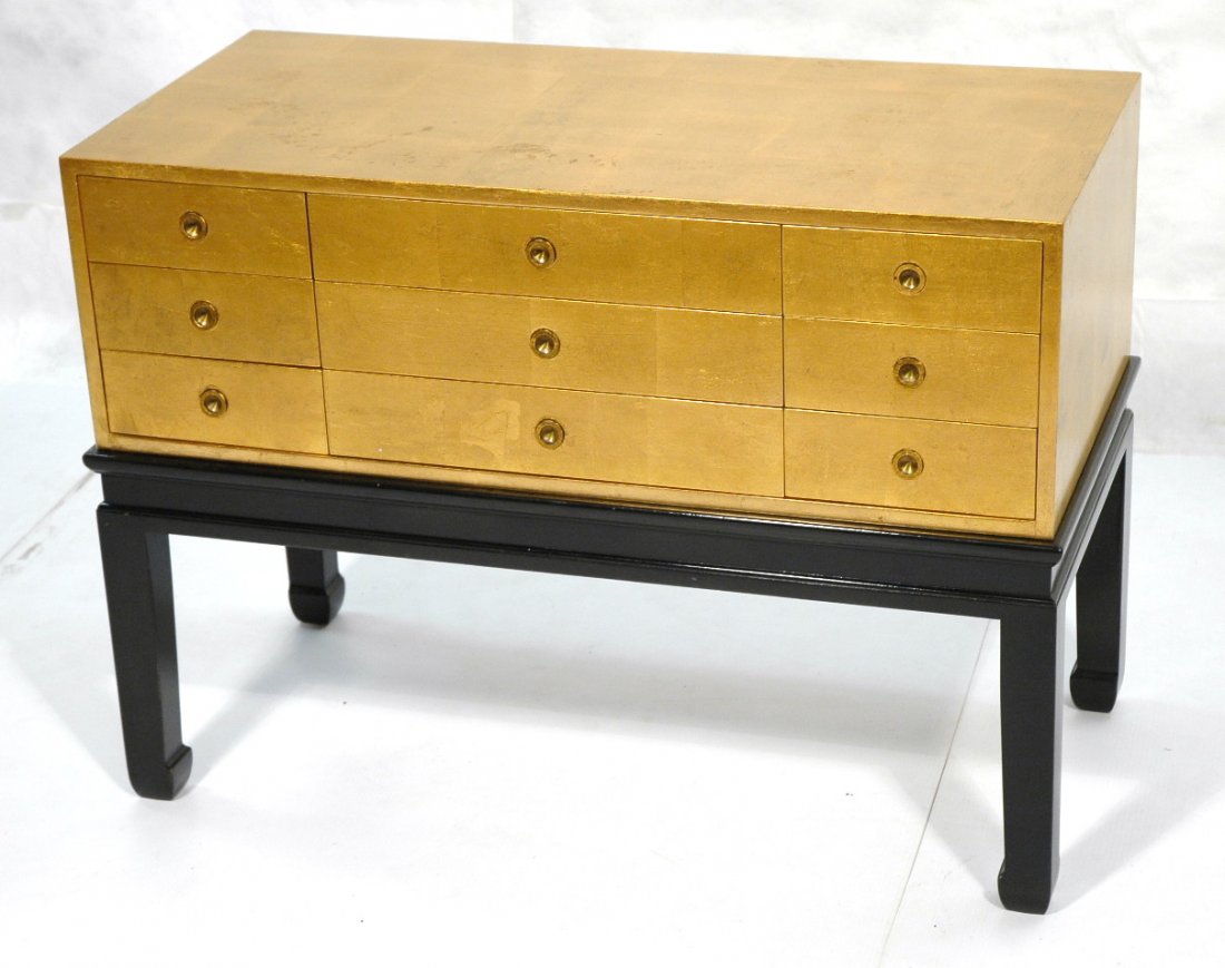 Kittinger Gold Leaf Chest On Stand. 9 Drawer cab: Kittinger Gold Leaf Chest On Stand. 9 Drawer cabinet, Inset metal pulls. Ebonized base. Great form.-- Dimensions: H: 28 inches: W: 39 inches: D: 19 inches ---