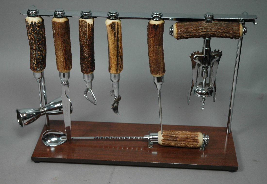 8pc Sheffield Decorator Ware Set. Stag handle on: 8pc Sheffield Decorator Ware Set. Stag handle on stand. Corkscrew etc.-- Dimensions: H: 11.25 inches: W: 15.75 inches: D: 5 inches --- US Shipping charge: $14