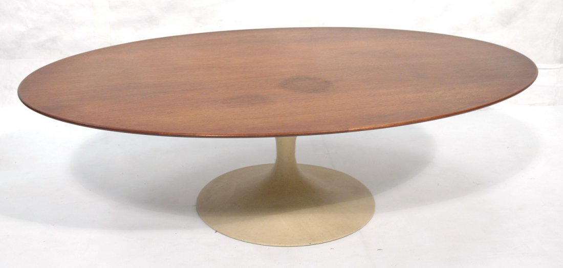 Eero Saarinen Coffee Cocktail Table. Knoll Label: Eero Saarinen Coffee Cocktail Table. Knoll Labeled. Walnut top on tulip base. Large oval top.-- Dimensions: H: 15.5 inches: W: 53.75 inches: D: 36 inches ---