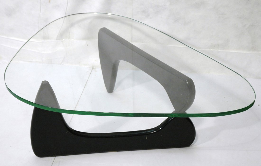 ISAMU NOGUCHI Ebonized Base Coffee Table. Glass T: ISAMU NOGUCHI Ebonized Base Coffee Table. Glass Top cocktail table.-- Dimensions: H: 16 inches: W: 36 inches: D: 51 inches ---