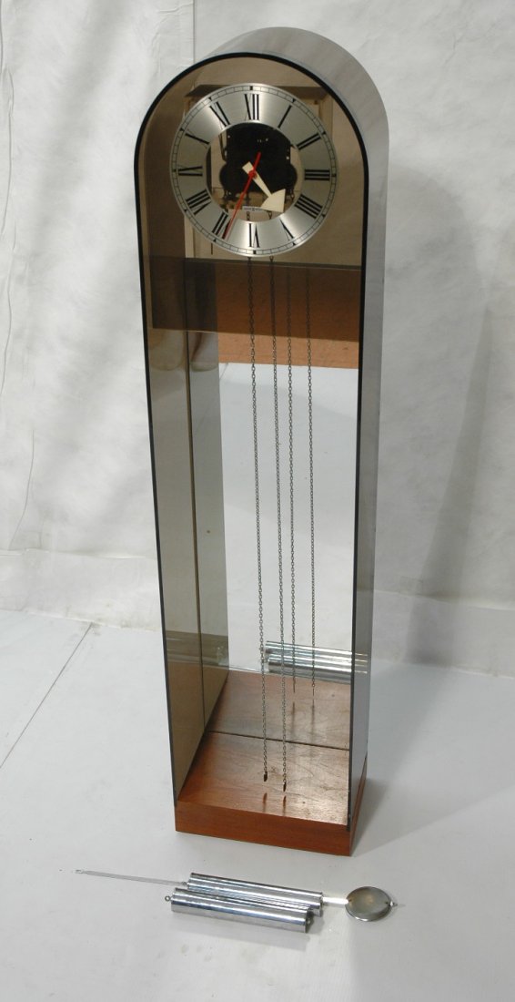 HOWARD MILLER Modernist Tall Case Clock. Smoked: HOWARD MILLER Modernist Tall Case Clock. Smoked Lucite acrylic with chrome pendants & weights. -- Dimensions: H: 55.25 inches: W: 13.25 inches: D: 9.25 inches ---