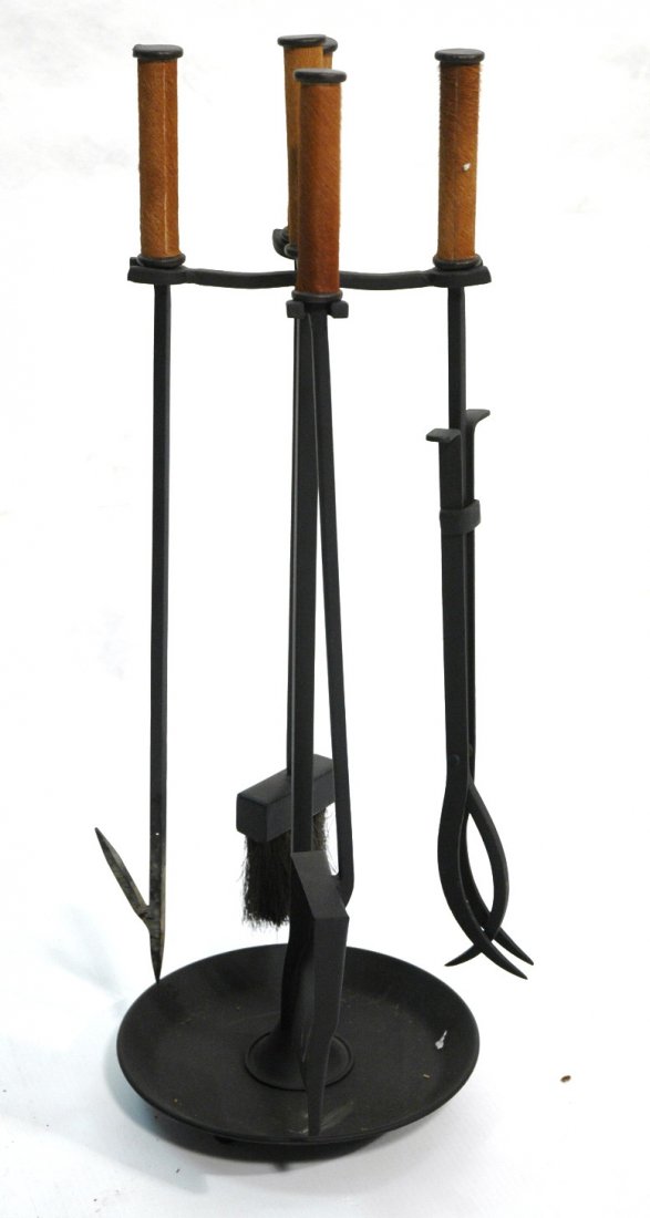 Set Cowhide Handled Fireplace Tools on Stand. Bla: Set Cowhide Handled Fireplace Tools on Stand. Black iron. Four tools on stand. -- Dimensions: H: 31 inches: W: 10 inches ---
