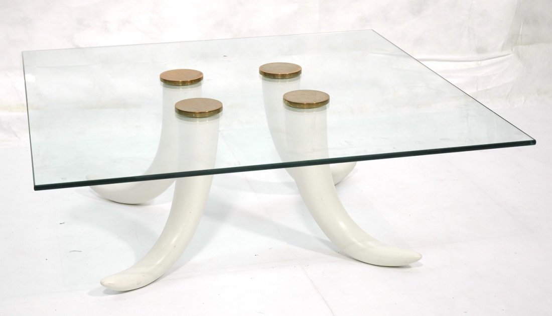 Decorator Glass Top Faux Tusk Coffee Table. Four: Decorator Glass Top Faux Tusk Coffee Table. Four faux tusk legs with brass caps. Square glass top. -- Dimensions: H: 14.5 inches ---