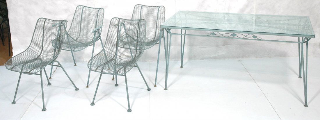 Outdoor Patio Table & 4 RUSSELL WOODARD Chairs. P: Outdoor Patio Table & 4 RUSSELL WOODARD Chairs. Pale turquoise blue painted metal set. 2 arm & 2 side chairs. Table with glass top. -- Dimensions: H: 33 inches: W: 23 inches: D: 21 inches ---