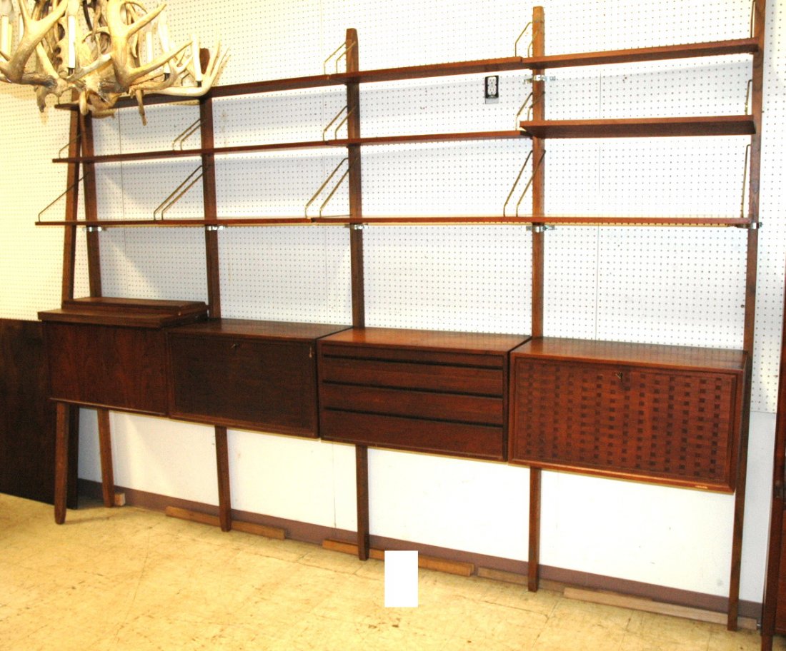POUL CADOVIUS Wall Unit. Danish Modern Shelf Unit: POUL CADOVIUS Wall Unit. Danish Modern Shelf Unit with 4 Cabinet Sections, "L" desk section, 6 larger shelves, 10 smaller shelves. Six uprights. -- Dimensions: H: 95.25 inches: D: 42 inches: L: 159 in