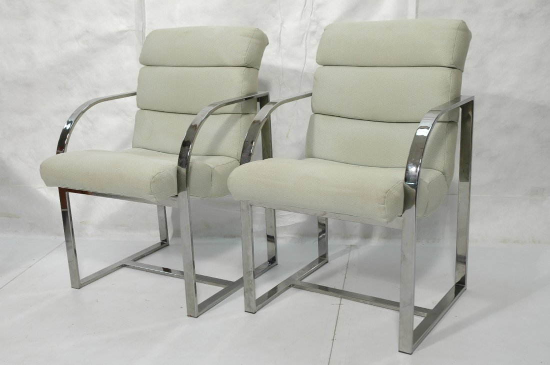 Pr MILO BAUGHMAN Style Chrome Arm Chairs. Arched: Pr MILO BAUGHMAN Style Chrome Arm Chairs. Arched form wide flat chrome arms. Horizontally tufted fabric upholstery. Not marked. -- Dimensions: H: 34 inches: W: 22 inches: D: 27 inches ---