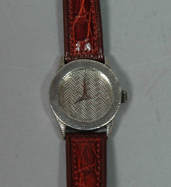 John Hardy Collection Sterling Watch. Original L: John Hardy Collection Sterling Watch. Original Leather band Marked John Hardy. Swiss made. 1.25" case. Woven design.-- Dimensions: H: 1.25 inches: L: 8.5 inches --- US Shipping charge: $7
