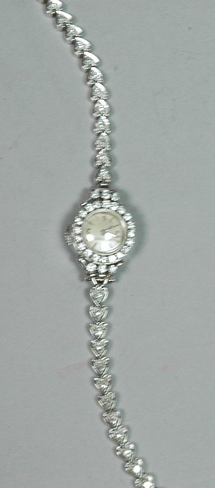 JAEGER LECOULTRE Ladies 14K Gold & Diamond Watch.: JAEGER LECOULTRE Ladies 14K Gold & Diamond Watch. 14K White gold. 20 diamond bezel. 34 diamonds on frame & straps. -- Dimensions: : L: 6.5 inches--- Weight: 13.2 DWT --- US Shipping charge: $7