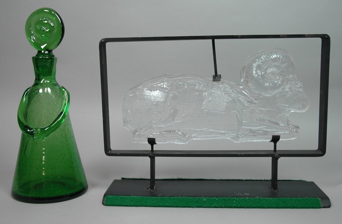 2pcs Erik Hoglund Glass. Sculpture in iron frame: 2pcs Erik Hoglund Glass. Sculpture in iron frame and Green stoppered bottle. Metal marked Boda.-- Dimensions: H: 9.75 inches: W: 13 inches: D: 4.25 inches --- US Shipping charge: $28