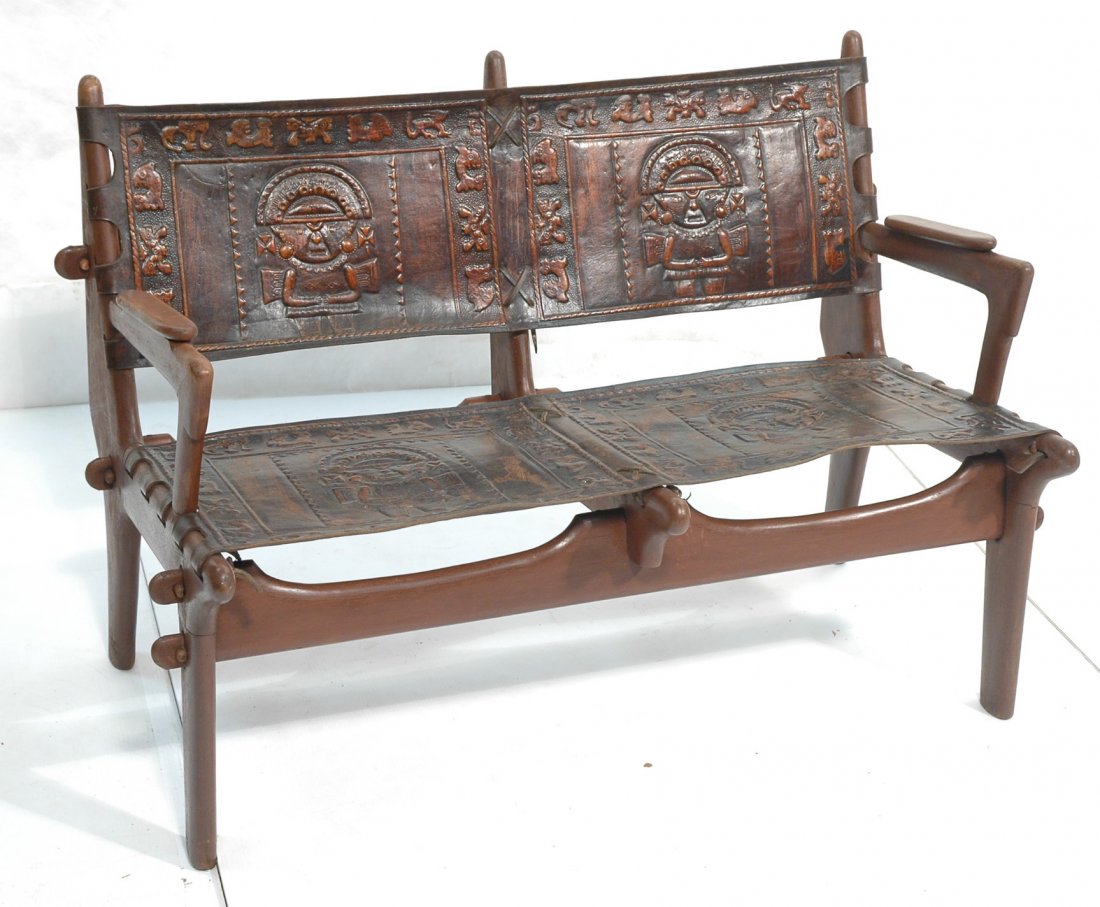 Brazilian Wood Two Seater Sofa. Tooled Leather Se: Brazilian Wood Two Seater Sofa. Tooled Leather Seat with Mayan designs. Sergio Rodriguez style-- Dimensions: H: 30 inches: W: 42 inches: D: 26 inches ---