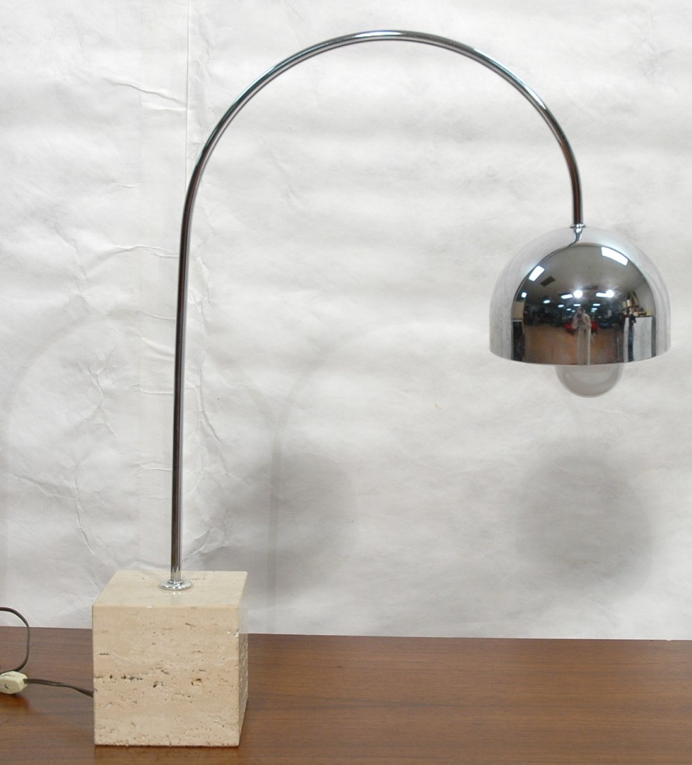 Sonneman Table Lamp. Arched chrome top on travert: Sonneman Table Lamp. Arched chrome top on travertine base. Unmarked.-- Dimensions: H: 24 inches: W: 20 inches: D: 5 inches ---