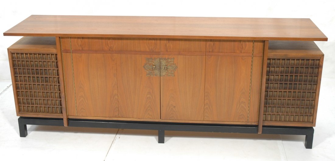 American Modern Walnut Credenza Sideboard. Large: American Modern Walnut Credenza Sideboard. Large decorative brass door pulls on trifold doors. Two interior shelves. Side compartments were speakers. -- Dimensions: H: 32.25 inches: D: 20.25 inches: L