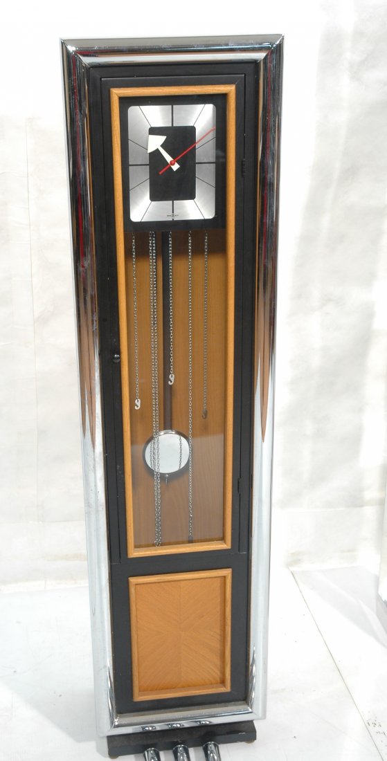 Howard Miller Tall Case Clock. George Nelson. Chr: Howard Miller Tall Case Clock. George Nelson. Chrome and Wood.-- Dimensions: H: 63.5 inches: W: 16 inches: D: 10.5 inches ---