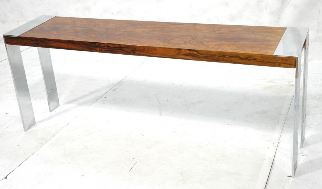 Rosewood & Chrome Banded Console Table. MILO BAUG: Rosewood & Chrome Banded Console Table. MILO BAUGHMAN style. 4" wide chrome trim & legs. -- Dimensions: H: 24 inches: D: 14 inches: L: 60 inches ---