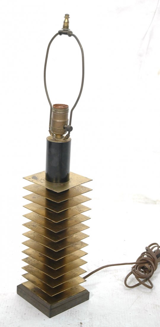 DONALD DESKEY style Column Table Lamp. Thin brass: DONALD DESKEY style Column Table Lamp. Thin brass plates between black Bakelite column pieces. Heavy construction. Art Deco detailing. -- Dimensions: H: 24 inches: W: 4 inches ---