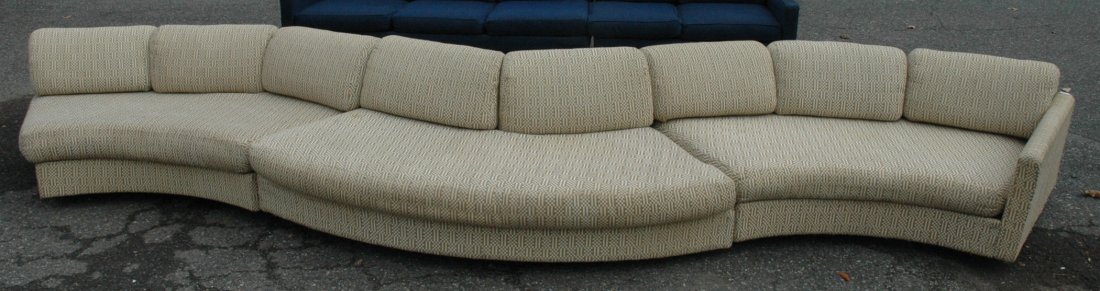 Milo Baughman Attributed Section Sofa Couch. Long: Milo Baughman Attributed Section Sofa Couch. Long serpentine curved Sofa with loose cushions. Wood base. -- Dimensions: H: 22 inches: D: 37 inches: L: 190 inches ---