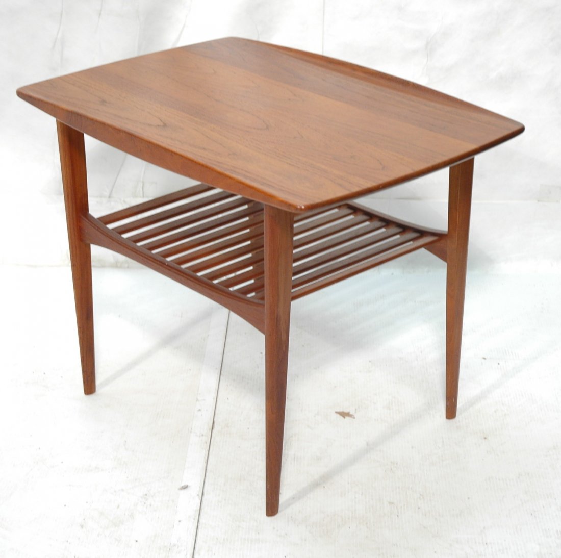 GRETE JALK France Daverkosen Teak Side Table. Ra: GRETE JALK France Daverkosen Teak Side Table. Raised lip sides. Slat lower shelf. France Mark: FD Denmark.-- Dimensions: H: 23 inches: W: 20 inches: D: 29 inches ---