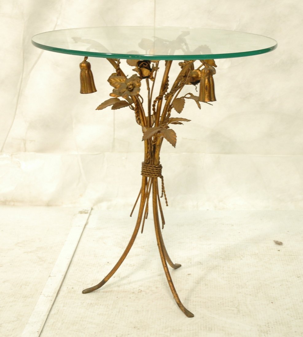 Italian Gilt Side Table with Round Glass Top. Flo: Italian Gilt Side Table with Round Glass Top. Floral & Tassel design. -- Dimensions: H: 22.5 inches: W: 20 inches: D: 20 inches ---