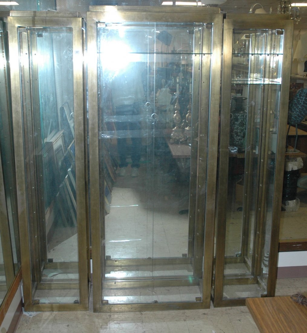 Lg. Brass Mastercraft Style Showcase cabinet. Lar: Lg. Brass Mastercraft Style Showcase cabinet. Large center cabinet, two side cabinets.-- Dimensions: H: 82 inches: W: 73 inches: D: 14.5 inches ---