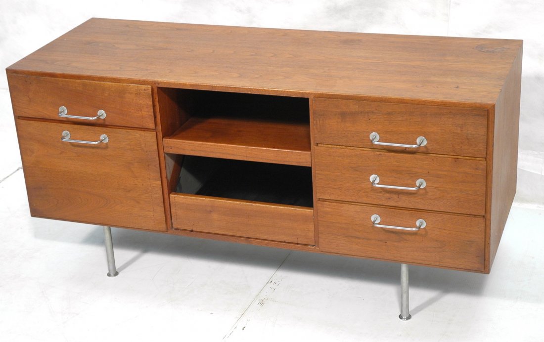 Knoll Walnut Credenza with chrome legs. Remnants: Knoll Walnut Credenza with chrome legs. Remnants of label.-- Dimensions: H: 26.5 inches: W: 54.5 inches: D: 21 inches ---