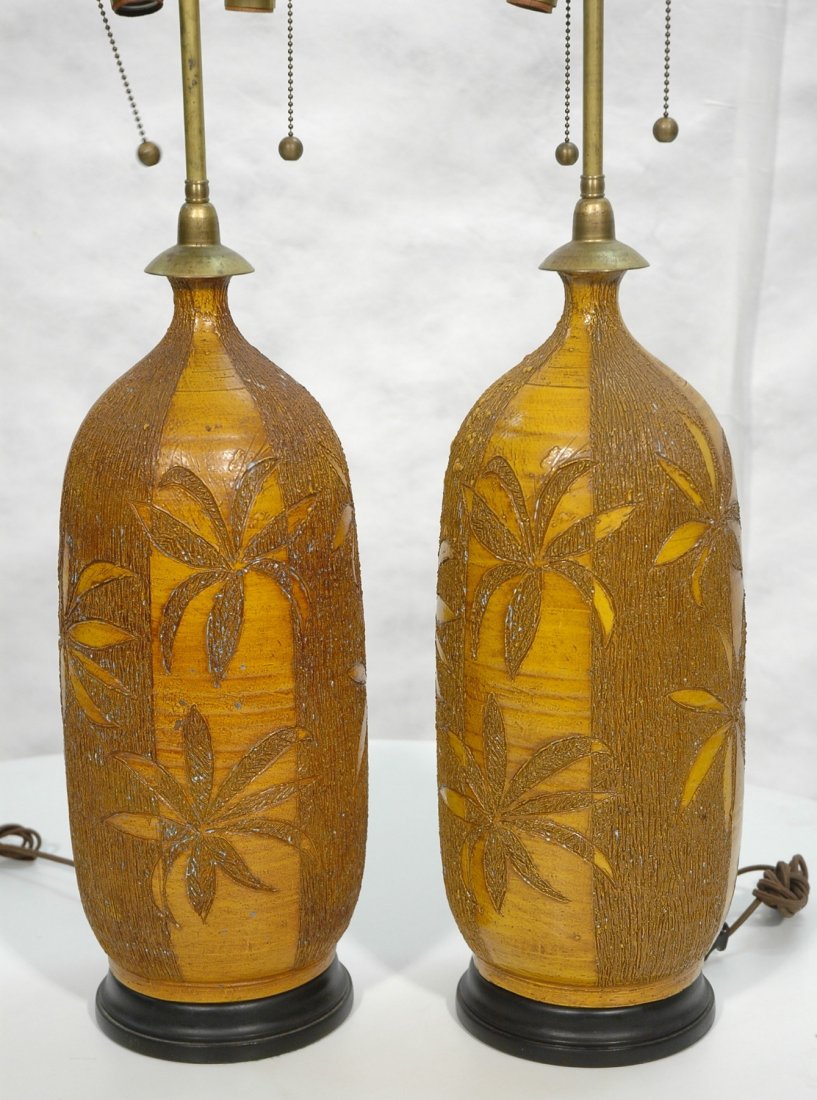 Pr 1970s Retro Pottery Lamps. Palm Tree design. M: Pr 1970s Retro Pottery Lamps. Palm Tree design. Marked illegibly.-- Dimensions: H: 32 inches: W: 9 inches: D: 9 inches ---