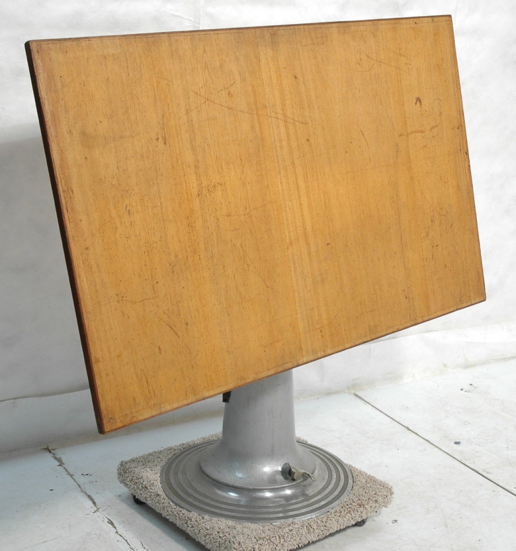 Lg. Industrial Drafting Table by NIKE. Wood Top o: Lg. Industrial Drafting Table by NIKE. Wood Top over Aluminum and steel base. Adjustable.-- Dimensions: H: 54 inches: W: 59 inches: D: 23 inches ---