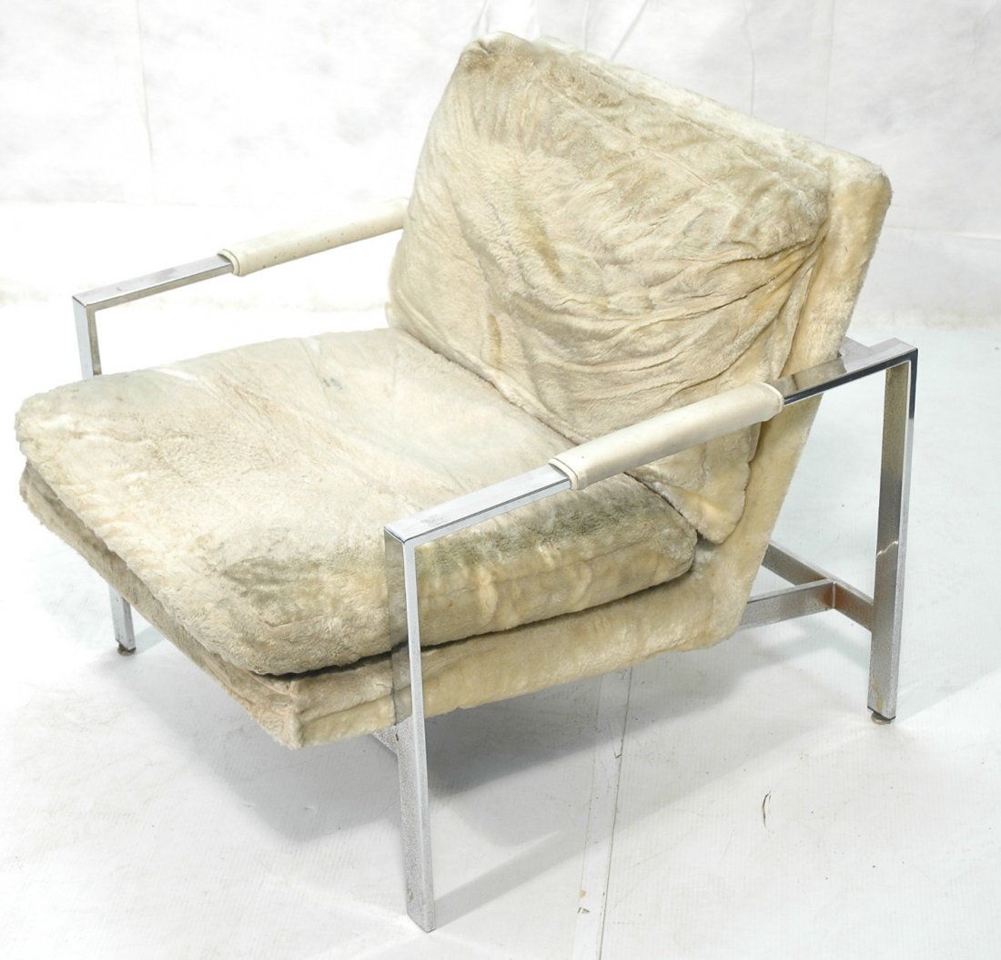 MILO BAUGHMAN Chrome Lounge Chair. Flat wide chro: MILO BAUGHMAN Chrome Lounge Chair. Has early tag under seat. Flat wide chrome. Cream color fabric upholstery. -- Dimensions: H: 28 inches: W: 29 inches: D: 31.5 inches ---