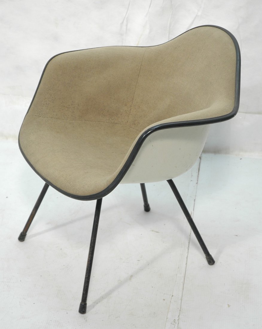 CHARLES EAMES for HERMAN MILLER Fiberglass Shell: CHARLES EAMES for HERMAN MILLER Fiberglass Shell Chair. Gray upholstery. Black metal legs. Marked. Label. 1974 -- Dimensions: H: 28 inches: W: 25 inches: D: 27.5 inches ---