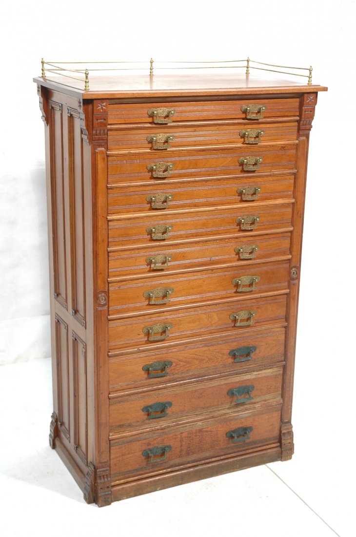 Victorian Eastlake Walnut Printers Cabinet. Brass: Victorian Eastlake Walnut Printers Cabinet. Brass hardware. 11 graduated drawers. Brass gallery.-- Dimensions: H: 57 inches: W: 93.5 inches: D: 19 inches ---