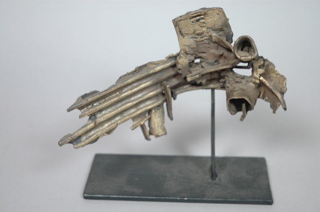 Bronze brutalist Sculpture. Signed T. AARKI 62. O: Bronze brutalist Sculpture. Signed T. AARKI 62. On custom black metal base stand. Signed on back.-- Dimensions: H: 5.5 inches: W: 7 inches: D: 2.5 inches --- US Shipping charge: $20