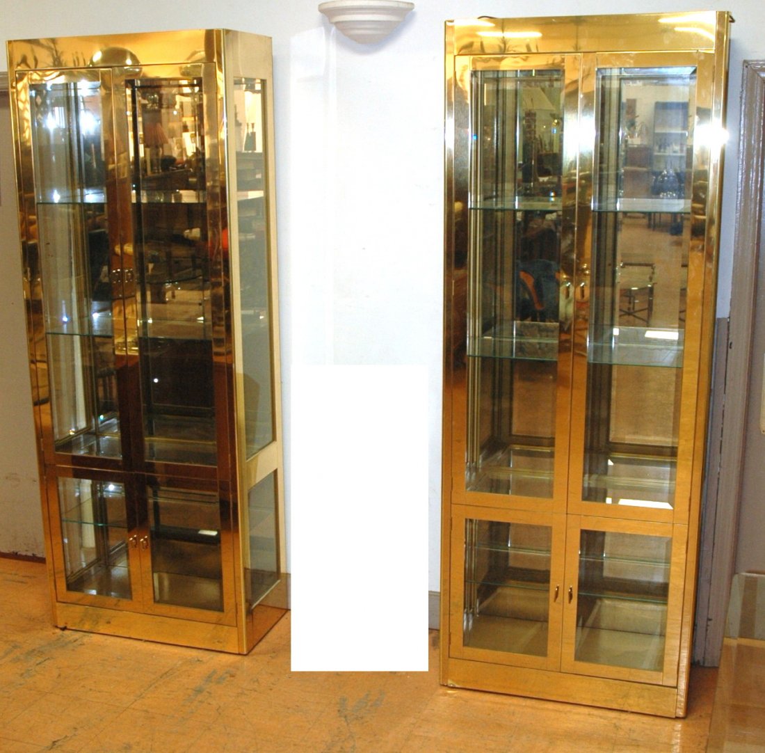 Pair Mastercraft Vitrine Display Cabinets. Mirro: Pair Mastercraft Vitrine Display Cabinets. Mirrored backs. Beveled glass. 4 Doors with glass shelves.-- Dimensions: H: 83.75 inches: W: 31.75 inches: D: 16.5 inches ---
