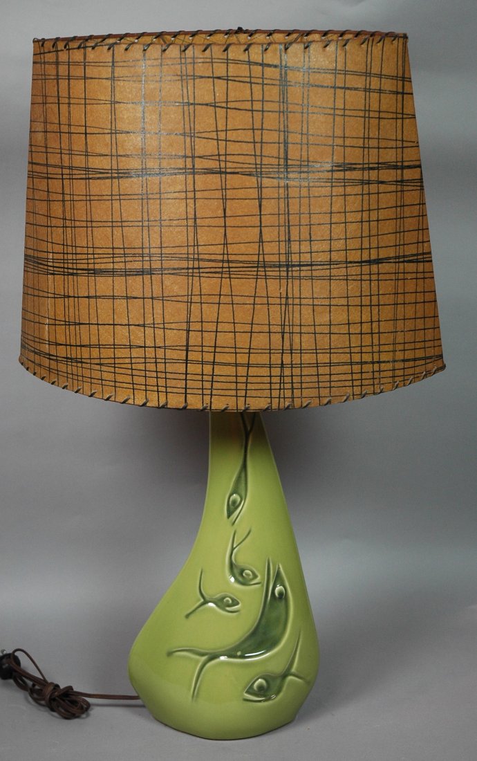 Modernist Pottery Fish Lamp with Original Almond: Modernist Pottery Fish Lamp with Original Almond Shaped Shade. Green pottery. Fish design.-- Dimensions: H: 31 inches: W: 19 inches: D: 11 inches ---