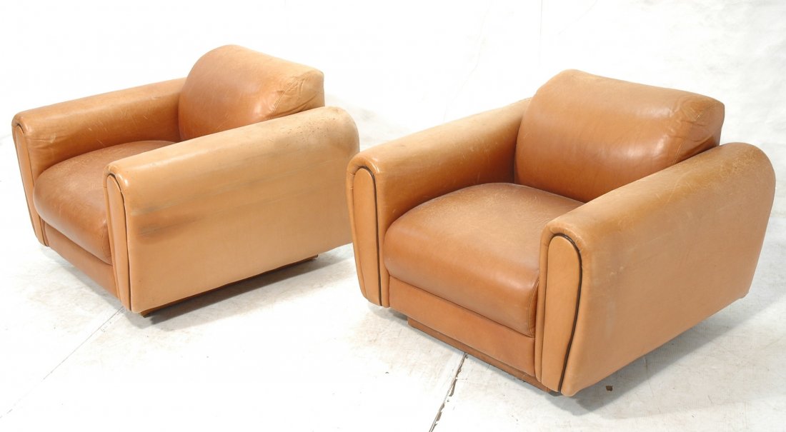 Pr DIRECTIONAL Leather Art Deco Club Chairs. Peri: Pr DIRECTIONAL Leather Art Deco Club Chairs. Period chairs in tan leather with black piping. -- Dimensions: H: 28 inches: W: 39 inches: D: 35 inches ---