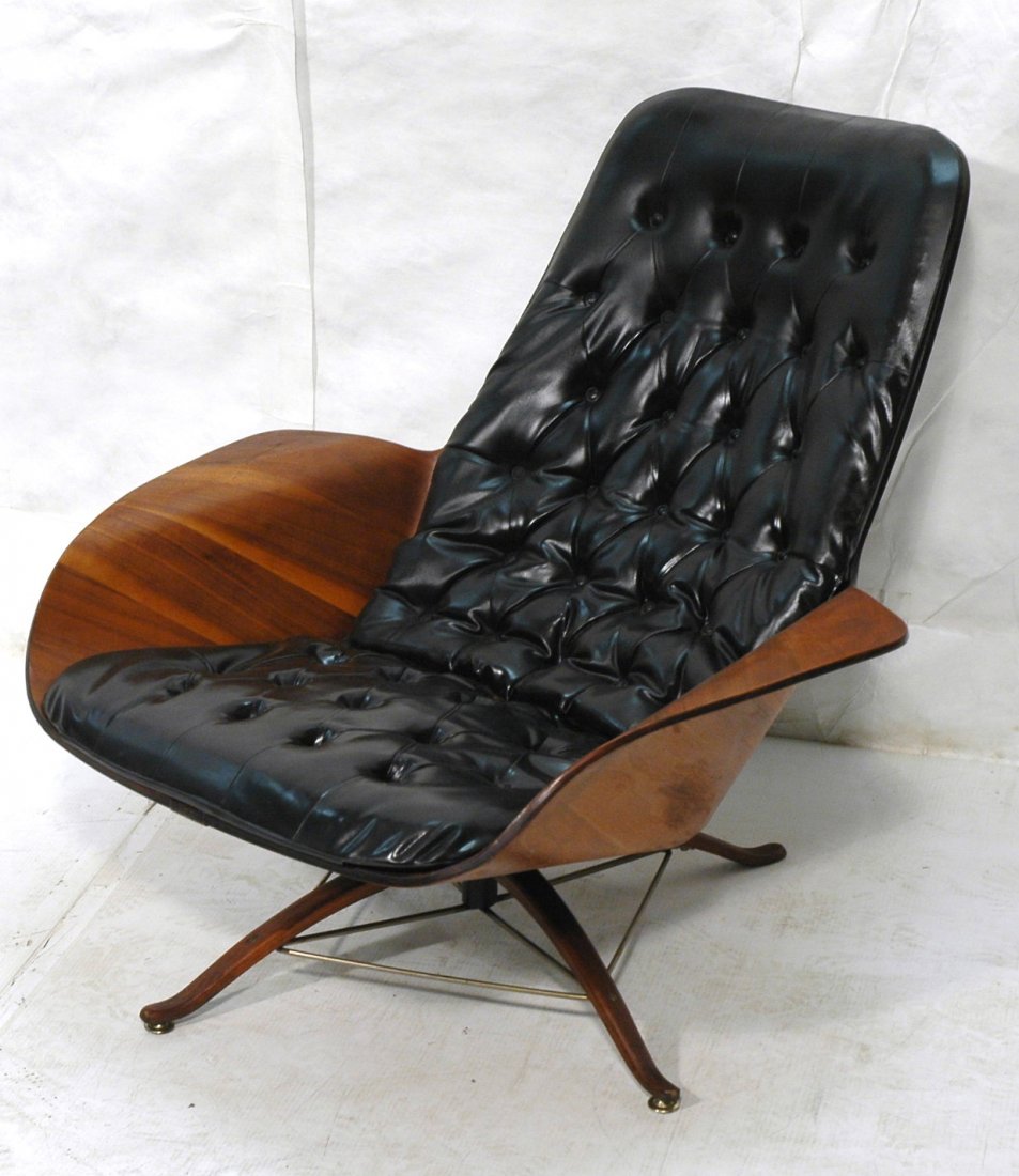 Unusual Plycraft Lounge Chair with Arched Base. M: Unusual Plycraft Lounge Chair with Arched Base. Molded walnut plywood. Labeled.-- Dimensions: H: 32 inches: W: 36 inches: D: 34.5 inches ---