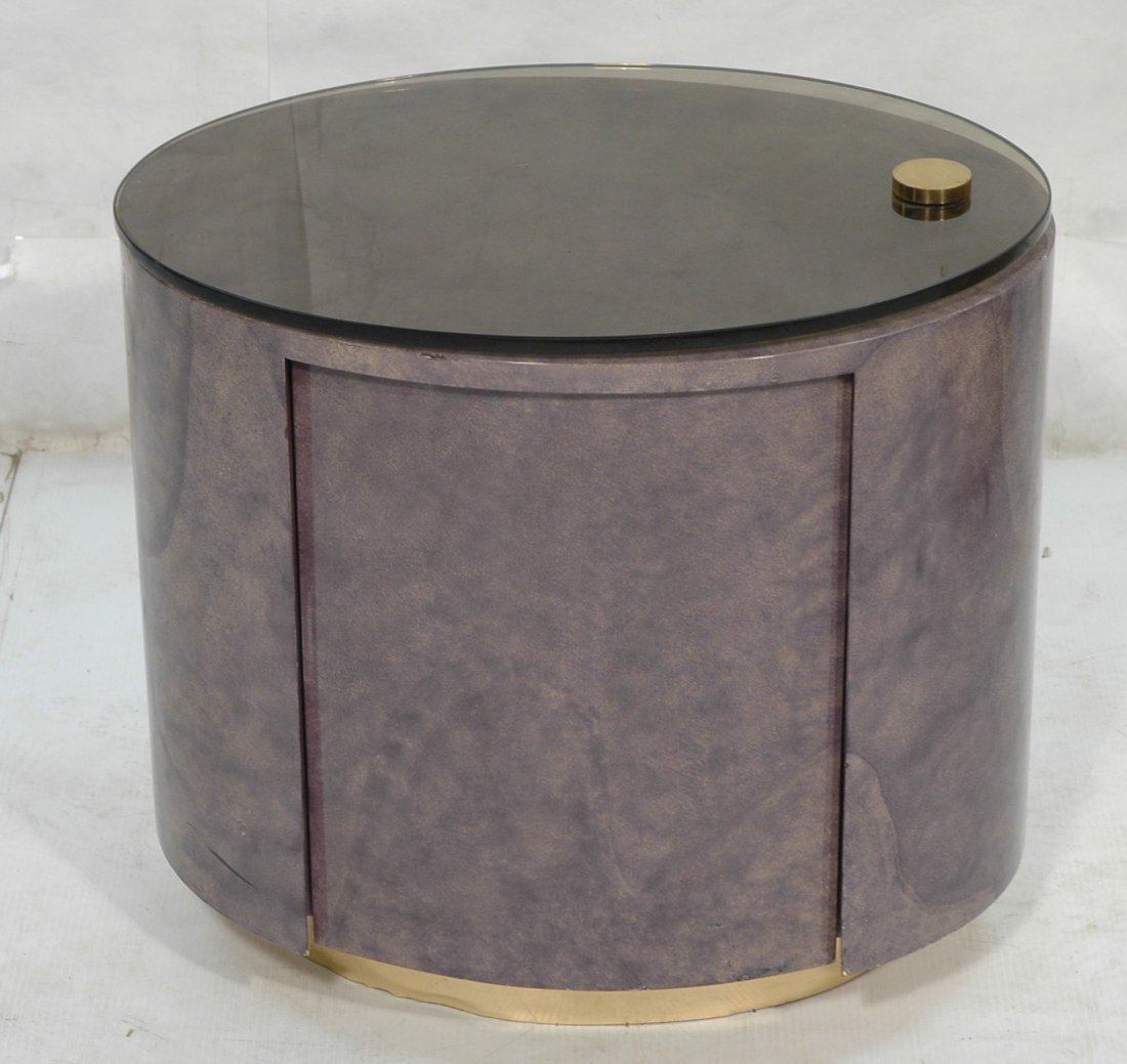 Karl Springer Style Side Occasional Table. Oval: Karl Springer Style Side Occasional Table. Oval with smoked glass top. Purple faux goatskin covering. 1 door.-- Dimensions: H: 22.5 inches: W: 24 inches: D: 17 inches ---