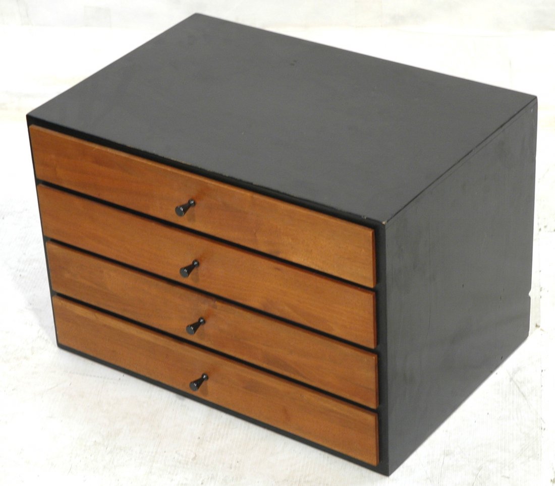 Four Drawer PAUL McCOBB Small Jewelry Cabinet. Am: Four Drawer PAUL McCOBB Small Jewelry Cabinet. American Modern Walnut. Ebonized wood frame with four walnut front drawers. Black metal pulls. Not marked.-- Dimensions: H: 16.5 inches: W: 24 inches: D: