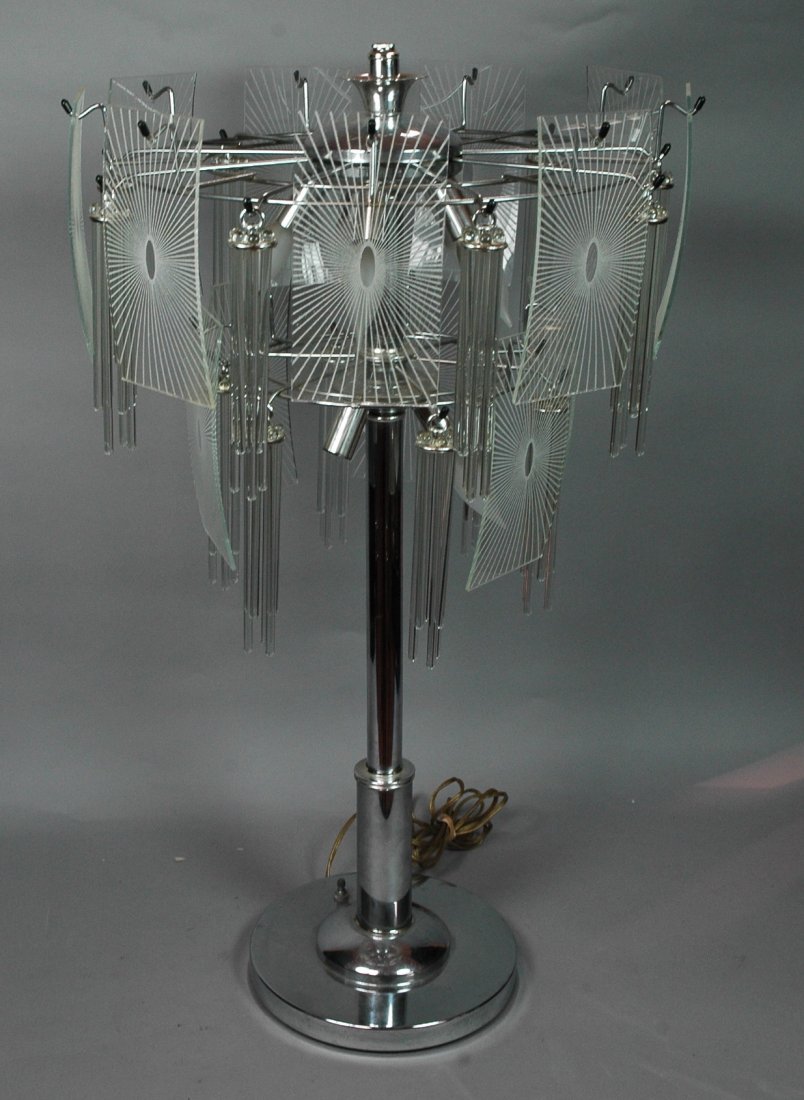 Unusual Chrome Table Lamp with Glass Rod Prisms.: Unusual Chrome Table Lamp with Glass Rod Prisms. Rectangular curved glass panels with sunburst design. Long glass rod prisms. -- Dimensions: H: 33 inches: W: 19 inches ---
