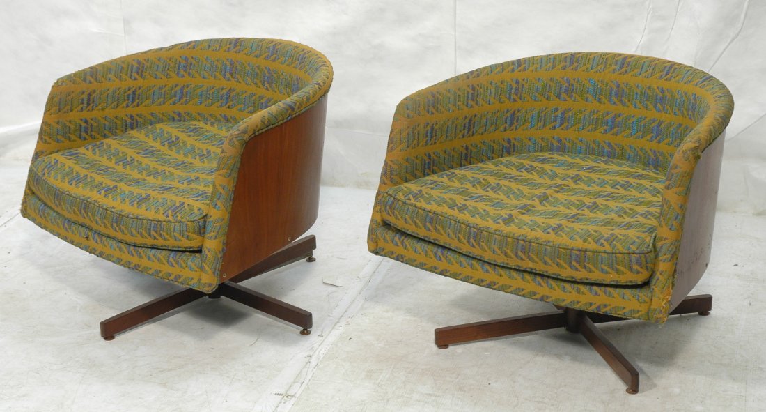 Pr MILO BAUGHMAN Walnut Barrel Back Lounge Chairs: Pr MILO BAUGHMAN Walnut Barrel Back Lounge Chairs. Swivel form. THAYER COGGIN. Gold fabric with blue, green & turquoise bands. Labels. -- Dimensions: H: 25.25 inches: W: 30 inches: D: 18 inches ---