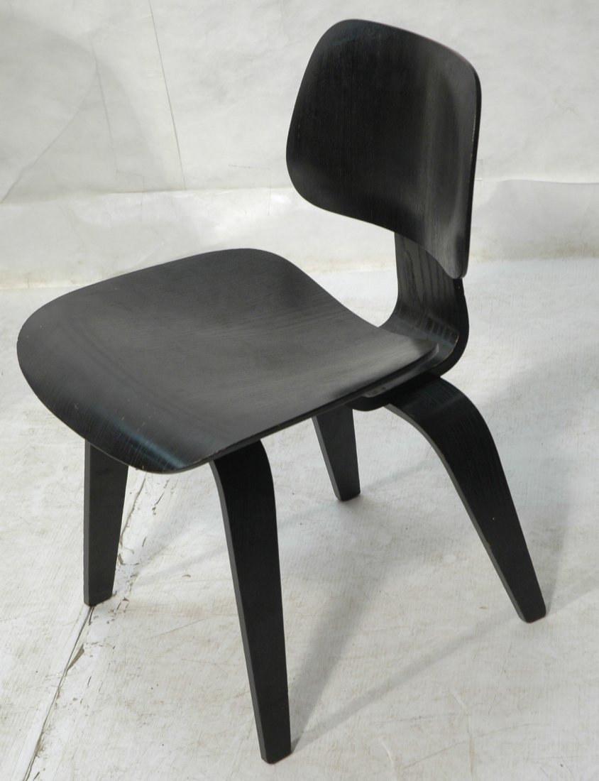 CHARLES EAMES Ebonized DCW Dining Chair. Marked D: CHARLES EAMES Ebonized DCW Dining Chair. Marked DCW. -- Dimensions: H: 28.75 inches: W: 19.5 inches: D: 21.5 inches ---
