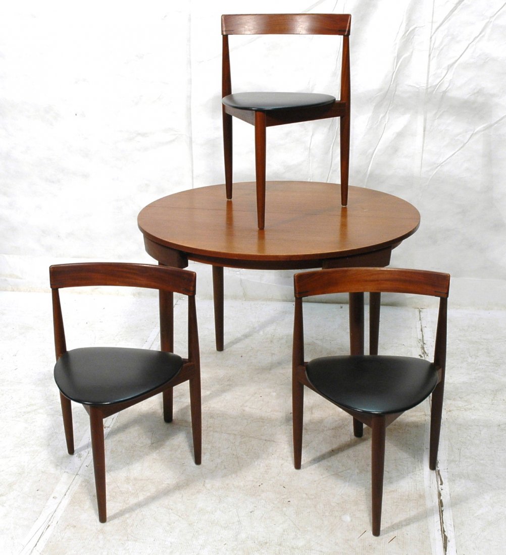 HANS OLSEN Danish Dining Table 3 Chairs. FREM ROJLE: HANS OLSEN Danish Dining Table Chairs. FREM ROJLE. Round Extension Table with 3 three legged triangular chairs. Three chairs fit nicely under table for clean tight look. Hidden fold out 19.5" leaf und