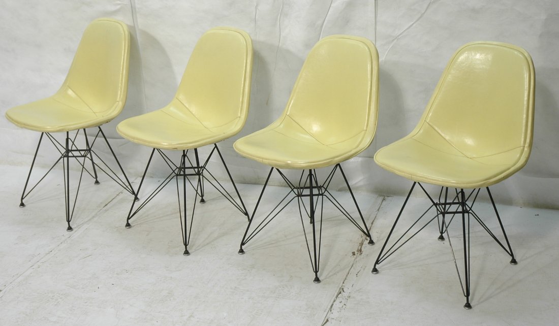 Set 4 Vintage CHARLES EAMES Eiffel Tower Chairs.: Set 4 Vintage CHARLES EAMES Eiffel Tower Chairs. Original yellow cushions. They have the good metal caps on the feet. Label. -- Dimensions: H: 31.75 inches: W: 19 inches: D: 19 inches ---