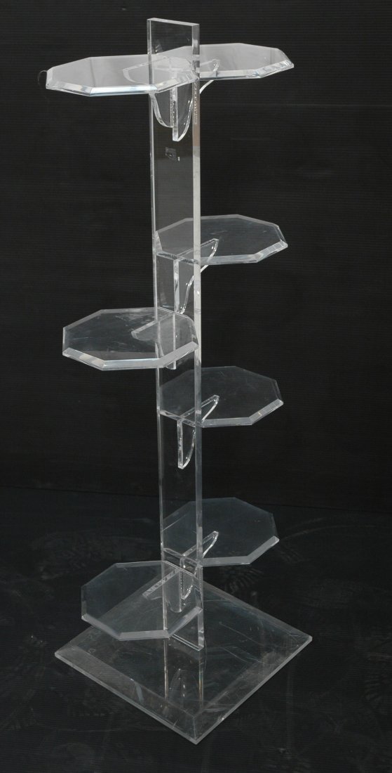 Lucite Multi Level Plant Stand. Seven octagonal s: Lucite Multi Level Plant Stand. Seven octagonal shelves on Lucite stem & base.-- Dimensions: H: 50.25 inches: W: 19 inches: D: 9.25 inches ---