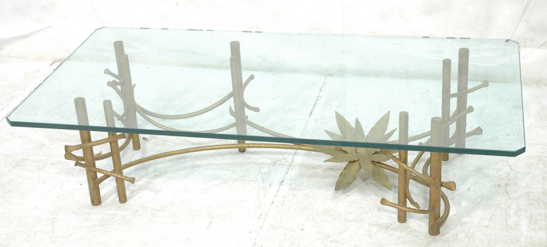 Decorator Iron & Glass Cocktail Coffee Table. Gol: Decorator Iron & Glass Cocktail Coffee Table. Gold painted metal base with Asian inspired metal work. Thick glass top. -- Dimensions: H: 15.25 inches: W: 60 inches: D: 29.75 inches ---