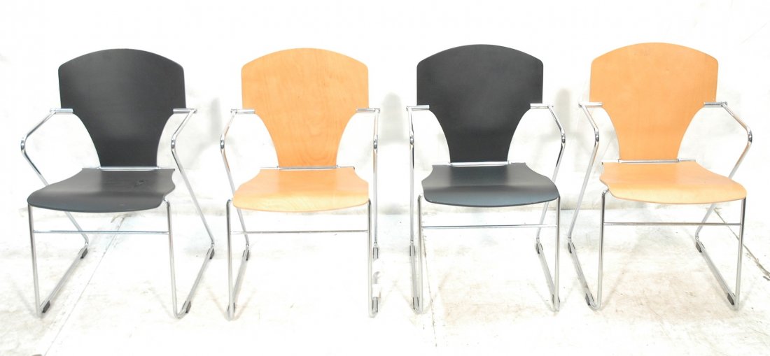 Set 4 Stacking Side Chairs. Chrome Frames with Wo: Set 4 Stacking Side Chairs. Chrome Frames with Wood seats & backs. Unique spring action. Two ebonized. Two natural wood color. -- Dimensions: H: 32 inches: W: 20.25 inches: D: 23 inches ---