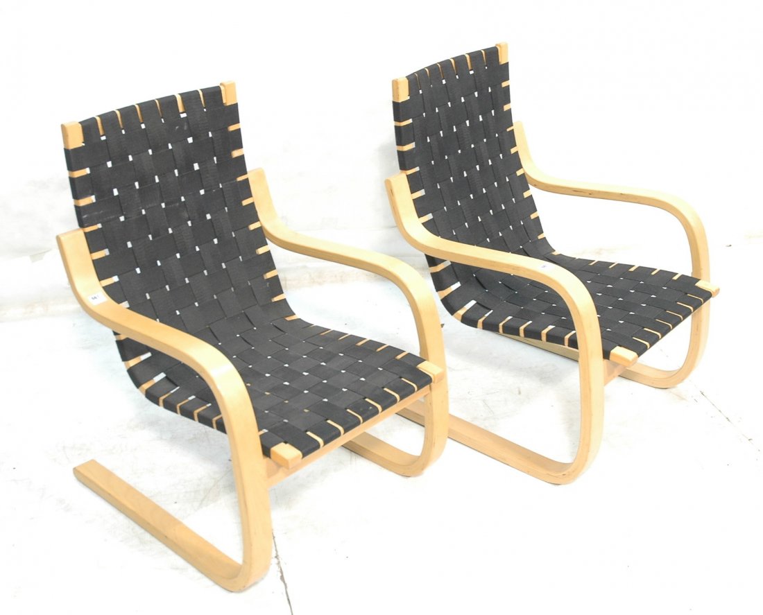 Pair Alvar Aalto Lounge Chairs. Spring Frames.: Pair Alvar Aalto Lounge Chairs. Spring Frames. Woven black webbing. Artek Finland.-- Dimensions: H: 35 inches: W: 23.5 inches: D: 28 inches ---