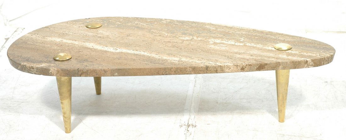 Italian Brown Travertine Coffee Cocktail Table.: Italian Brown Travertine Coffee Cocktail Table. Tapered brass legs. Shaped beveled edge top. Possibly Monteverdi-Young.-- Dimensions: H: 16 inches: W: 60.5 inches: D: 28 inches ---